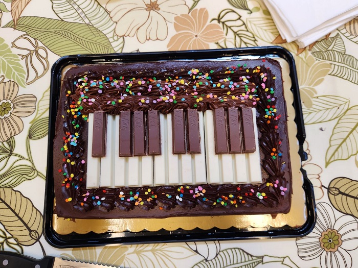 Cake decorated to look like piano keys.